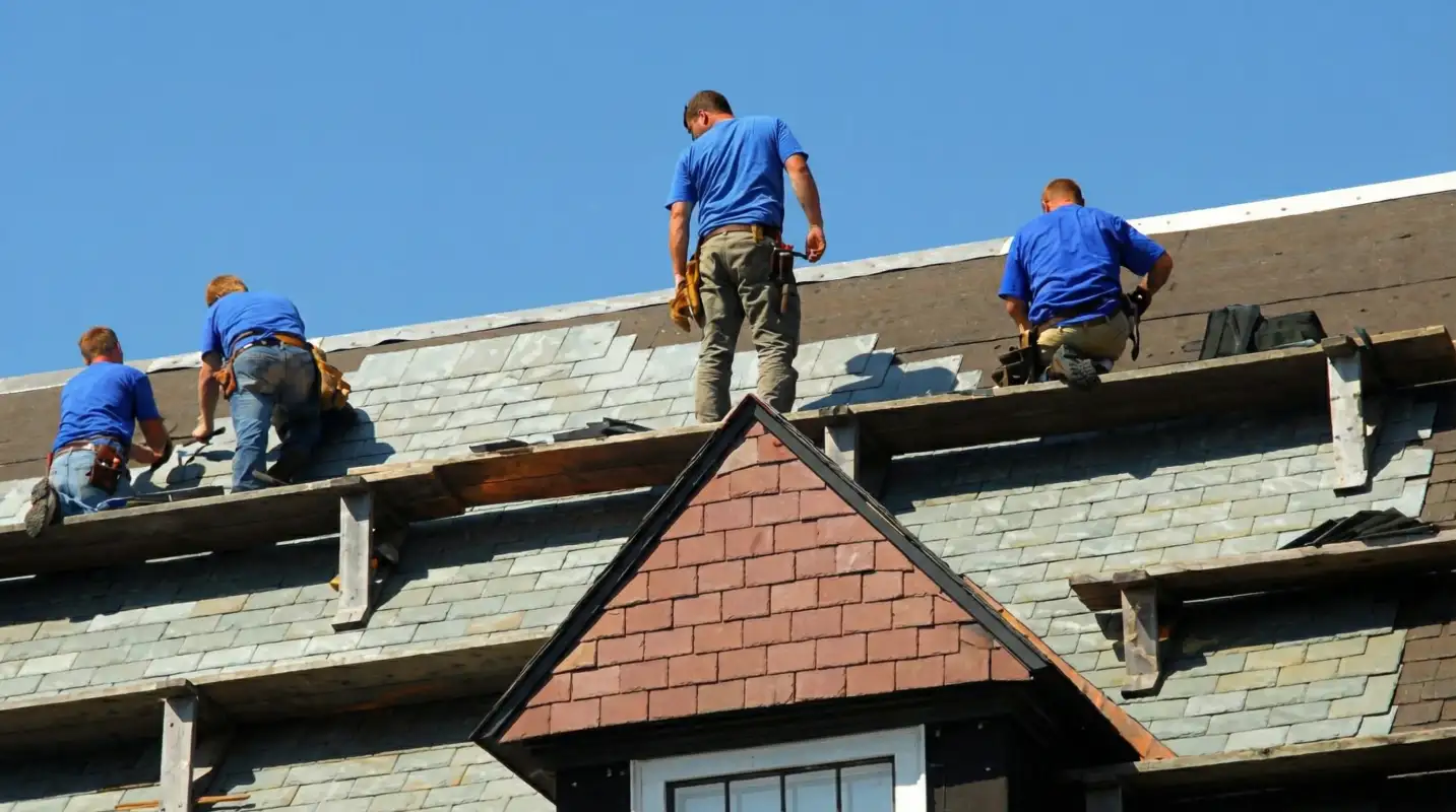 Roof replacement in progress with a team of professional contractors installing new shingles on a residential home in Myrtle Beach, SC