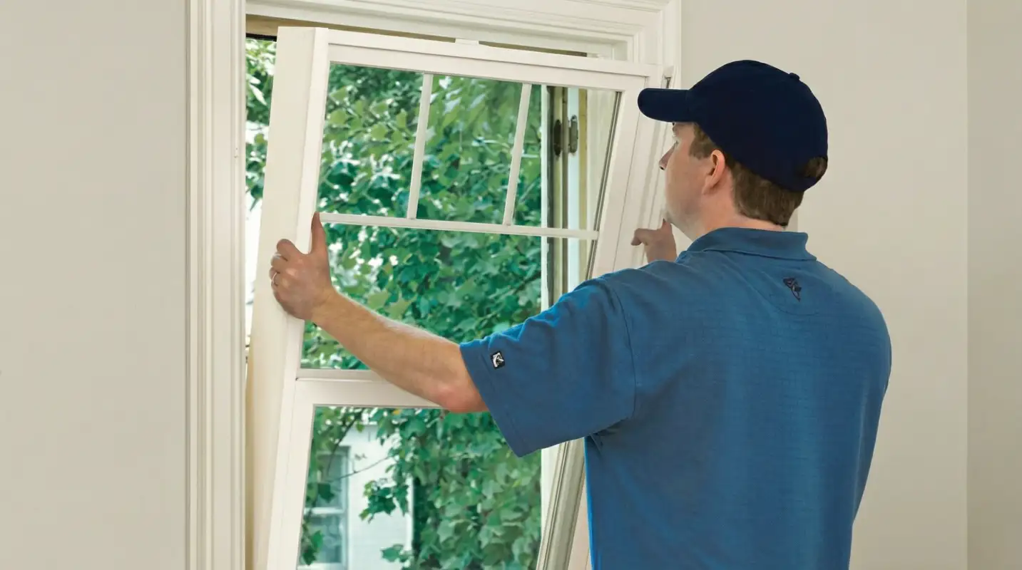 Professional contractors performing a residential window insulation and replacement service in Myrtle Beach, SC